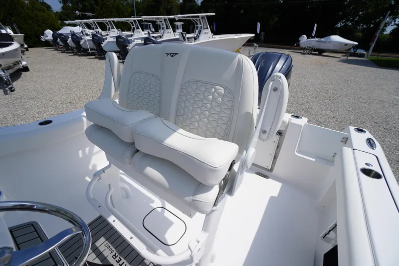 Slide: The Image of 2026 Tidewater 232 CC Adventure boat with luxurious white seating and modern design. - 49