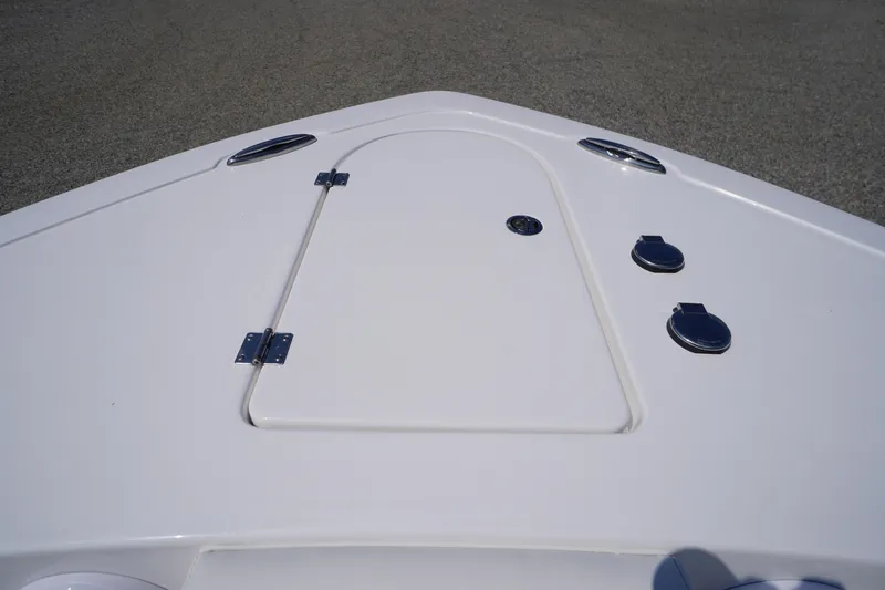 Slide: The Image of Bow deck of 2026 Tidewater 232 CC Adventure boat with storage hatch and fittings. - 5