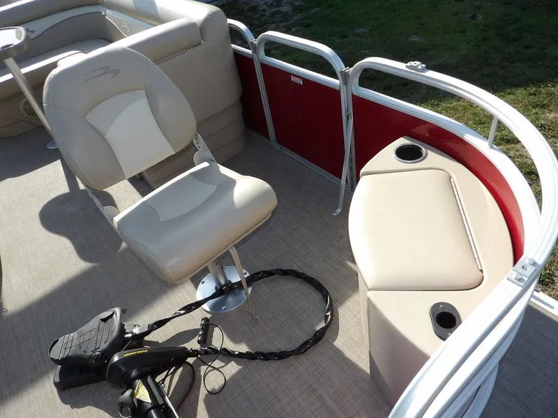Slide: The Image of 2015 Bennington 20 SFX pontoon boat interior with seating and fishing equipment. - 10