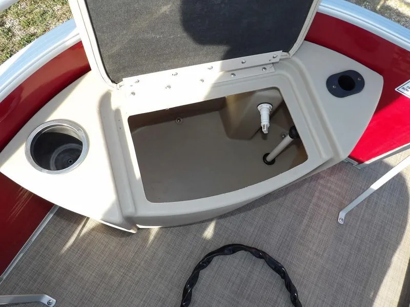Slide: The Image of Open storage compartment on a 2015 Bennington 20 SFX boat deck. - 11