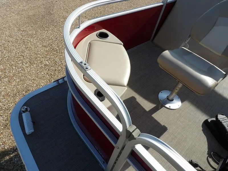 Slide: The Image of 2015 Bennington 20 SFX boat interior with seating and railing, featuring beige and red accents. - 13