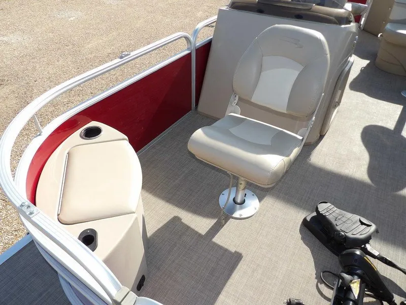 Slide: The Image of 2015 Bennington 20 SFX pontoon boat interior with seating and storage compartments. - 14