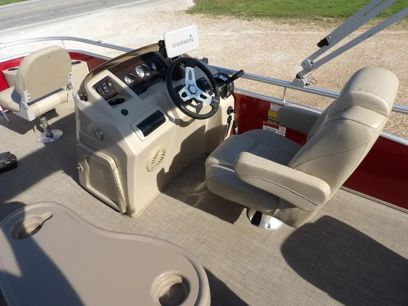 Slide: The Image of 2015 Bennington 20 SFX boat interior with steering console and beige seating. - 21