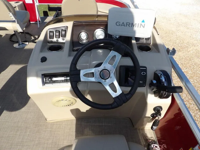 Slide: The Image of Steering console of a 2015 Bennington 20 SFX boat with Garmin navigation system. - 23