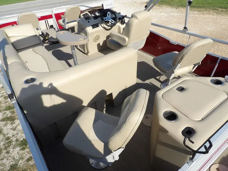 Slide: The Image of 2015 Bennington 20 SFX pontoon boat interior with beige seating and steering console. - 29