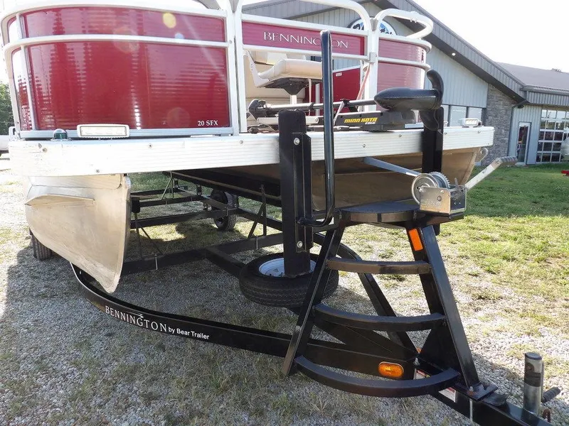 Slide: The Image of 2015 Bennington 20 SFX pontoon boat on trailer, parked outdoors. - 32
