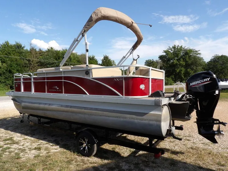 Slide: The Image of 2015 Bennington 20 SFX pontoon boat with Mercury outboard motor on trailer. - 4