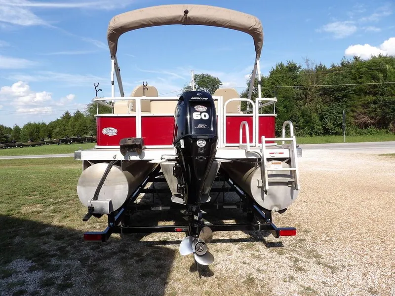 Slide: The Image of 2015 Bennington 20 SFX pontoon boat with Mercury 60 HP engine, parked on a trailer. - 6