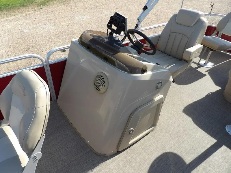 Slide: The Image of 2015 Bennington 20 SFX boat interior with steering console and seating. - 9