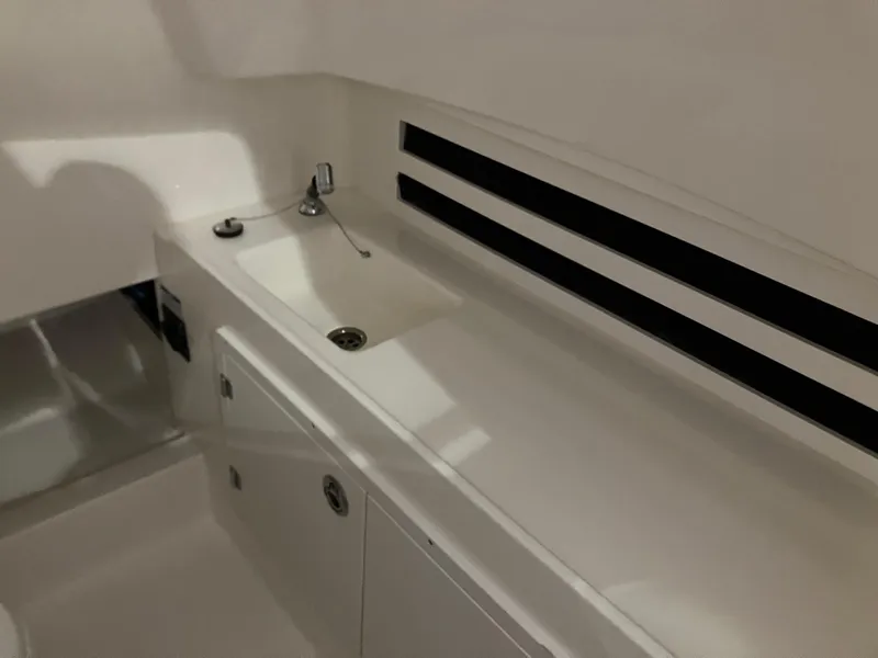 Slide: The Image of Interior sink area of 2025 Boston Whaler 330 Outrage boat. - 14
