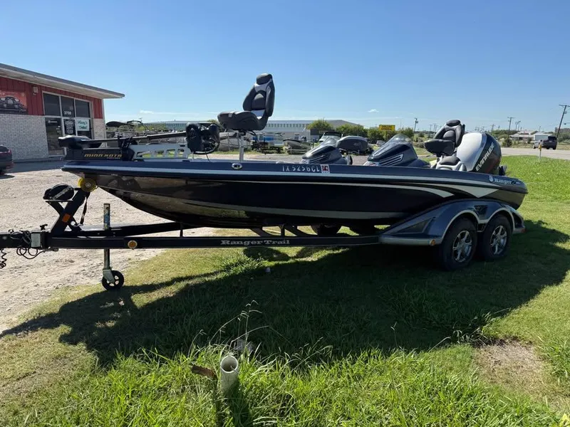 Slide: The Image of 2015 Ranger Z520 Comanche boat on trailer, parked on grass near a building. - 3