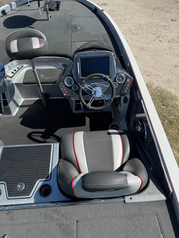 Slide: The Image of 2015 Ranger Z520 Comanche boat interior with steering console and seating. - 9