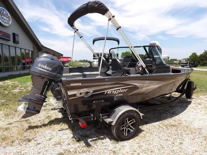 Slide: The Image of 2022 G3 Angler V164 F boat with Yamaha motor on trailer, parked outdoors. - 12
