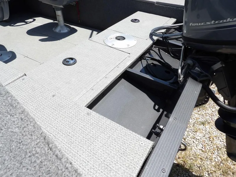 Slide: The Image of 2022 G3 Angler V164 F boat interior with motor and seating area. - 14