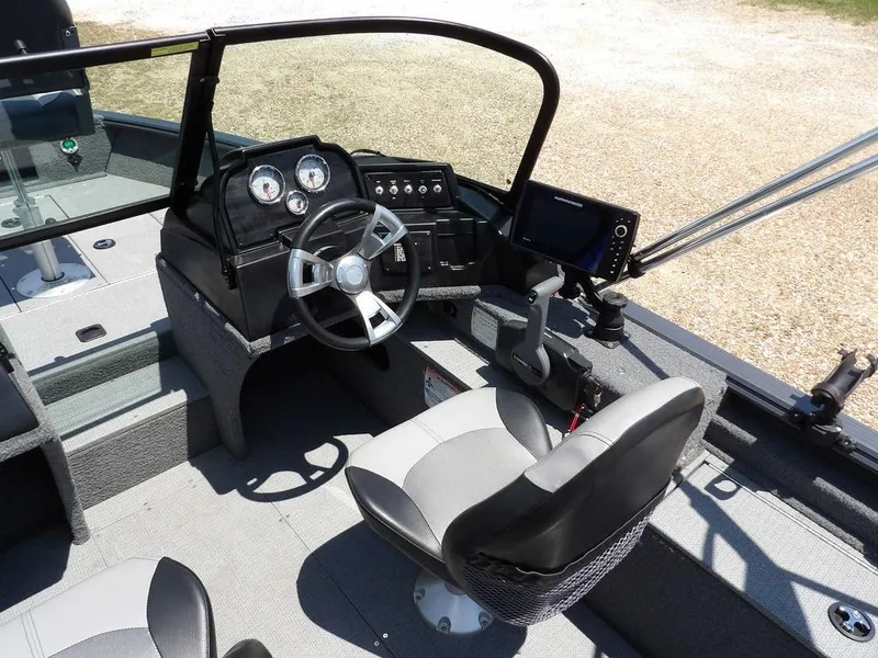 Slide: The Image of 2022 G3 Angler V164 F boat interior with steering wheel and control panel. - 16