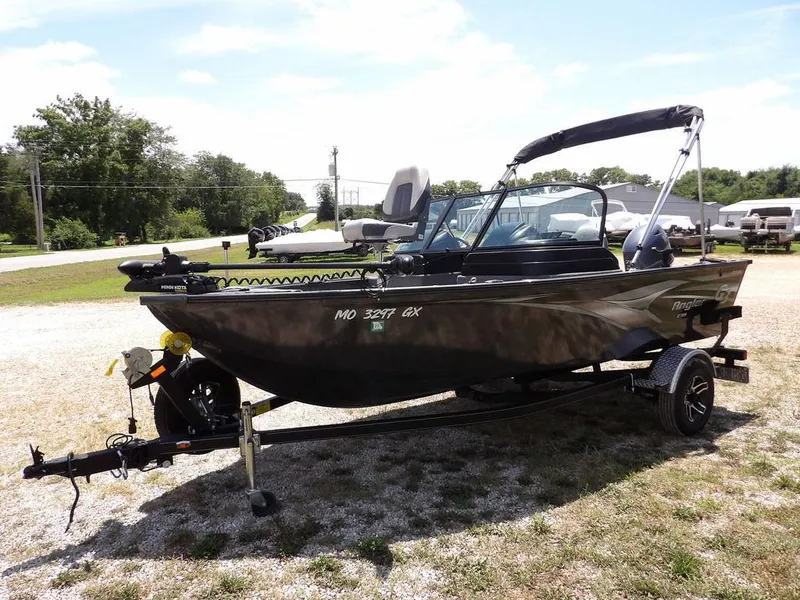 Slide: The Image of 2022 G3 Angler V164 F boat on trailer, parked outdoors on a sunny day. - 2
