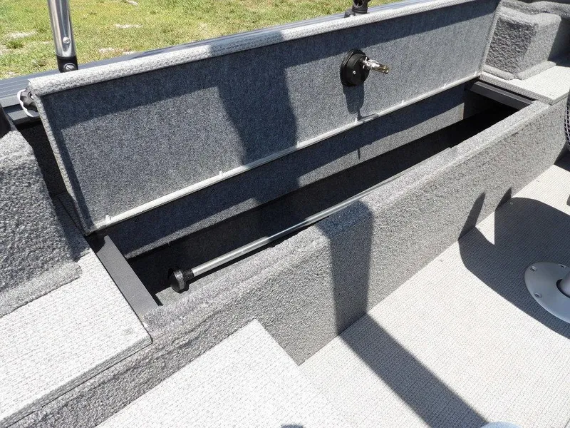 Slide: The Image of 2022 G3 Angler V164 F boat storage compartment with open lid, showing interior space. - 20