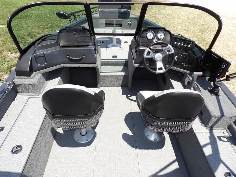 Slide: The Image of 2022 G3 Angler V164 F boat interior with dual seats and steering console. - 21