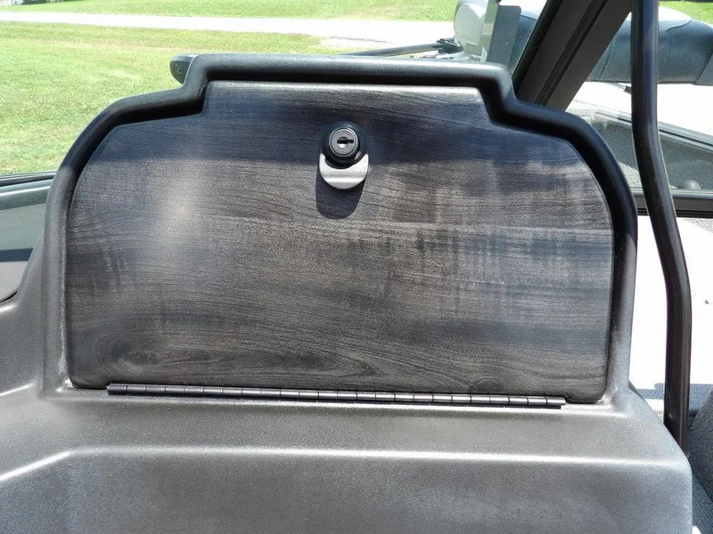 Slide: The Image of 2022 G3 Angler V164 F boat dashboard with a closed storage compartment. - 22