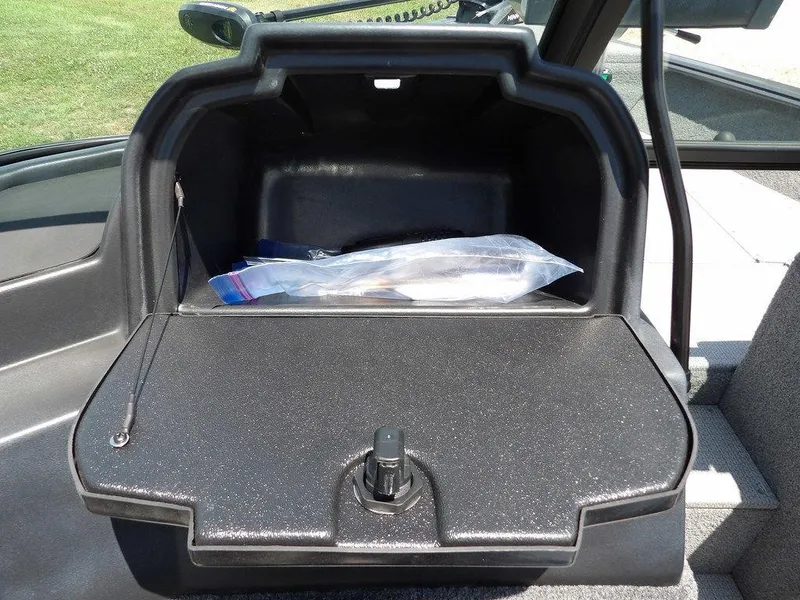 Slide: The Image of Storage compartment of 2022 G3 Angler V164 F boat, open with items inside. - 29