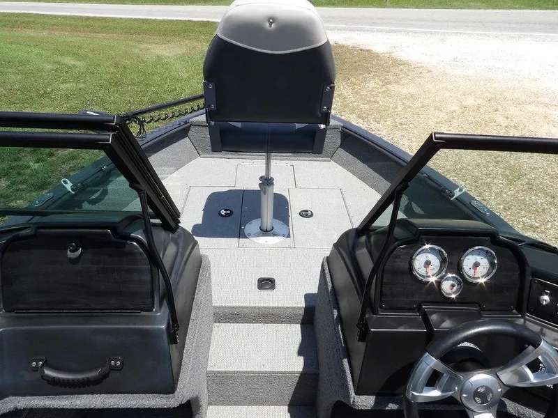 Slide: The Image of 2022 G3 Angler V164 F boat interior with dual consoles and steering wheel. - 30