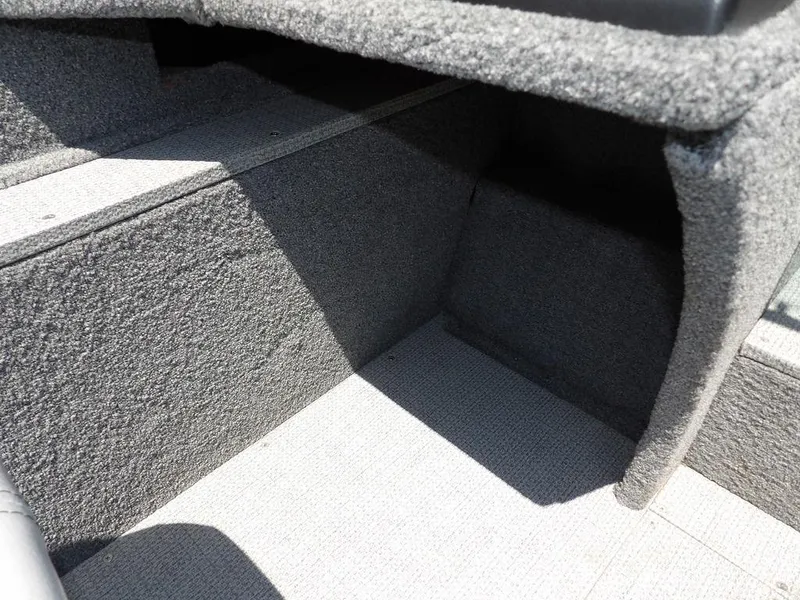 Slide: The Image of Interior view of 2022 G3 Angler V164 F boat, featuring carpeted storage area. - 32