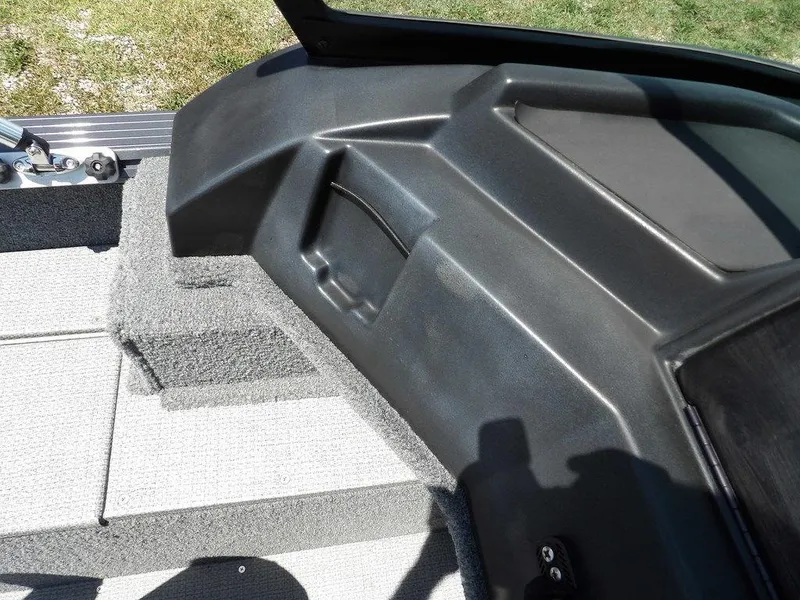 Slide: The Image of 2022 G3 Angler V164 F boat interior with carpeted flooring and storage compartment. - 34