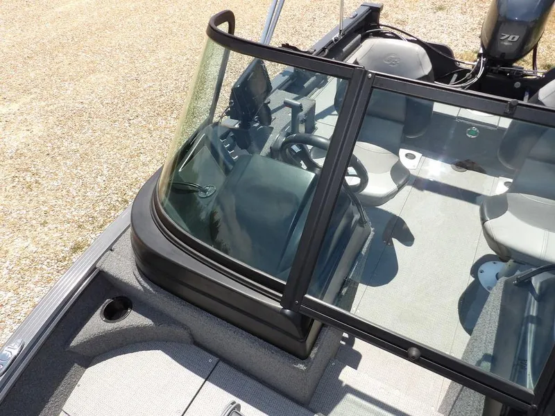 Slide: The Image of 2022 G3 Angler V164 F boat interior with steering wheel and seating. - 35