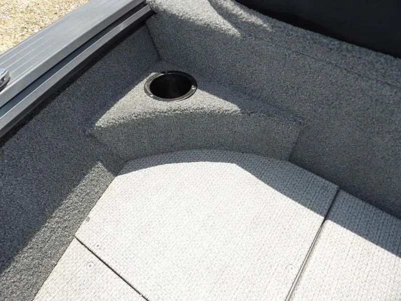 Slide: The Image of 2022 G3 Angler V164 F boat interior with carpeted flooring and cup holder. - 37