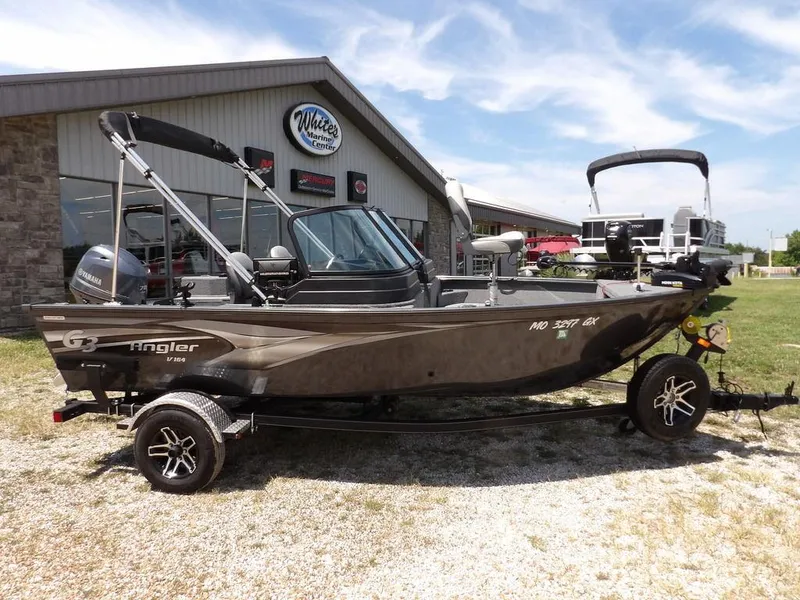 Slide: The Image of 2022 G3 Angler V164 F boat on trailer outside marine center. - 4