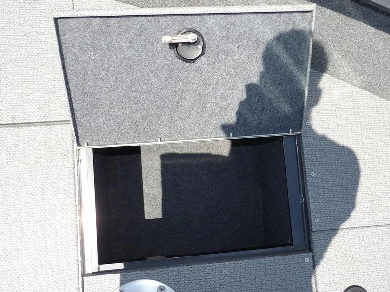 Slide: The Image of Open storage compartment on 2022 G3 Angler V164 F boat deck. - 40