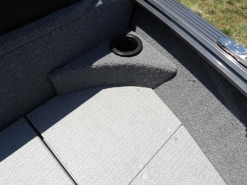 Slide: The Image of Interior of 2022 G3 Angler V164 F boat, featuring carpeted flooring and cup holder. - 41