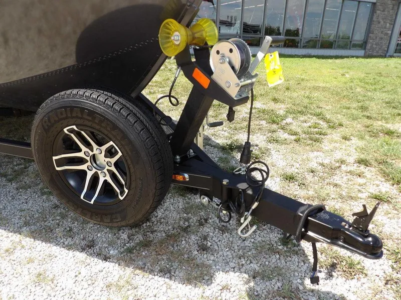 Slide: The Image of 2022 G3 Angler V164 F trailer hitch and wheel on gravel. - 48