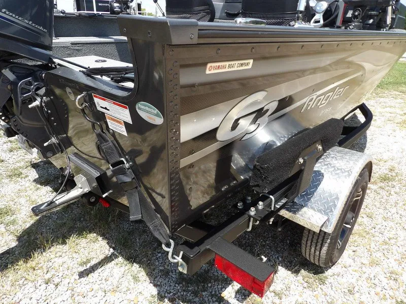 Slide: The Image of 2022 G3 Angler V164 F boat on trailer, featuring Yamaha components. - 49