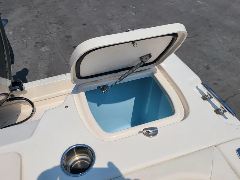 Slide: The Image of Open storage compartment on 2016 Grady-White Freedom 255 boat deck. - 16