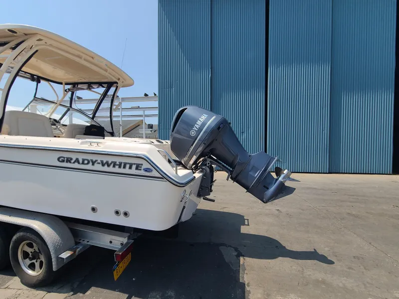 Slide: The Image of 2016 Grady-White Freedom 255 boat with Yamaha outboard motor on trailer. - 18