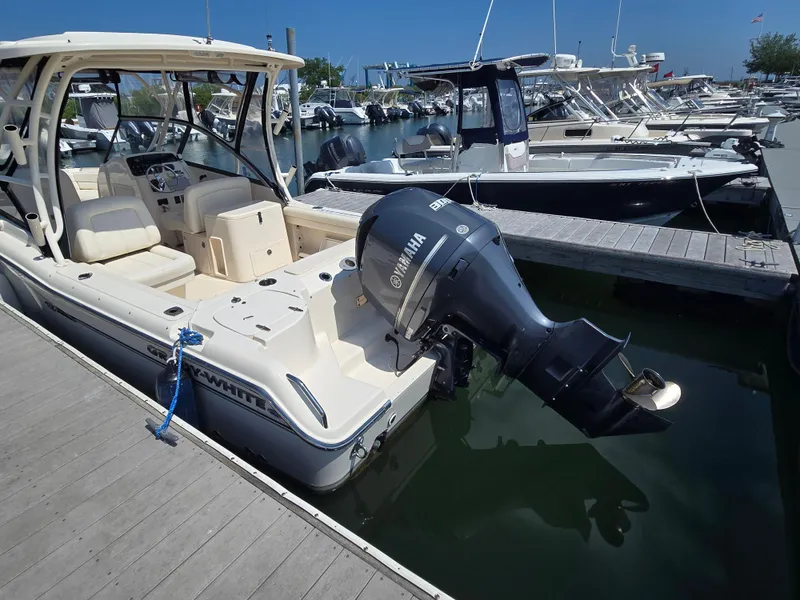 Slide: The Image of 2016 Grady-White Freedom 255 boat docked with Yamaha outboard motor. - 19
