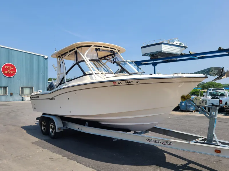 Slide: The Image of 2016 Grady-White Freedom 255 boat on trailer at marina. - 3