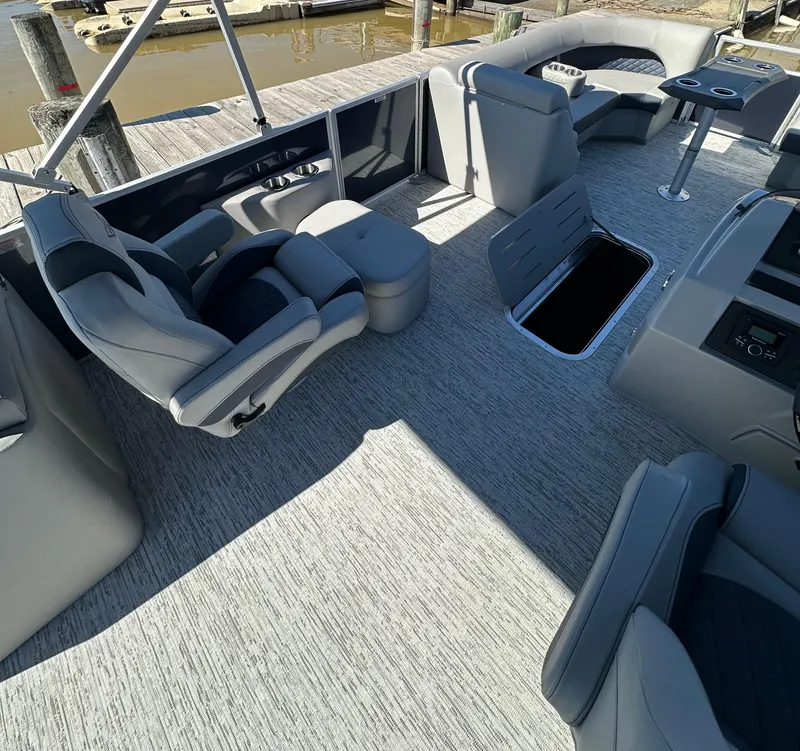 Slide: The Image of 2025 Bennington 23LFB pontoon boat interior with plush seating and modern design. - 9