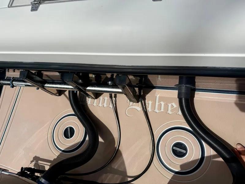 Slide: The Image of 2003 Bluewater Sportfishing 2850 boat deck with hoses and fittings. - 15