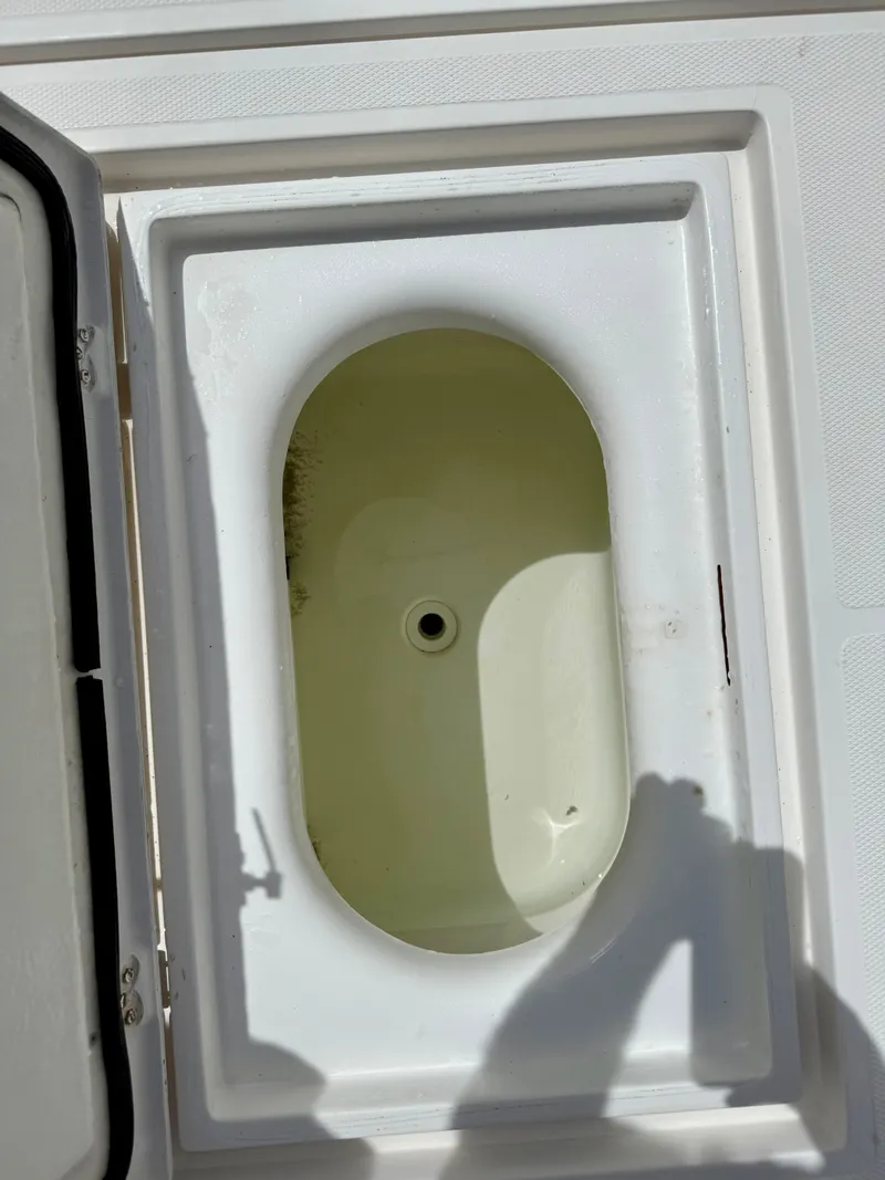Slide: The Image of Open storage compartment on 2003 Bluewater Sportfishing 2850 boat. - 21