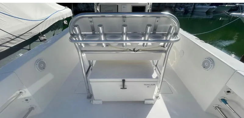 Slide: The Image of 2003 Bluewater Sportfishing 2850 boat deck with rod holders and storage. - 27