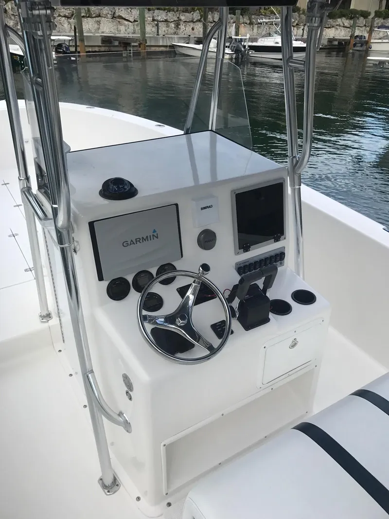 Slide: The Image of 2003 Bluewater Sportfishing 2850 boat console with Garmin navigation system. - 30