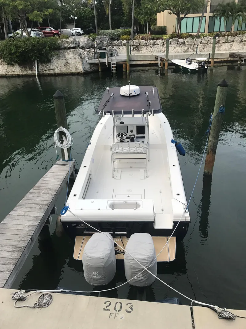 Slide: The Image of 2003 Bluewater Sportfishing 2850 boat docked in a marina, viewed from above. - 32