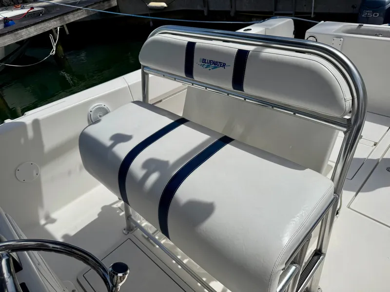 Slide: The Image of 2003 Bluewater Sportfishing 2850 boat seat with white and blue upholstery. - 4