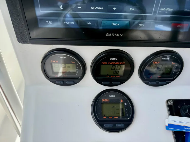 Slide: The Image of Dashboard of a 2003 Bluewater Sportfishing 2850 with Yamaha gauges and Garmin display. - 7