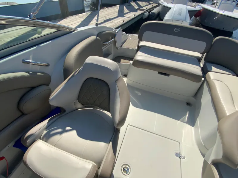 Slide: The Image of 2023 Crownline Eclipse E235 XS boat interior with luxurious seating and modern design. - 11
