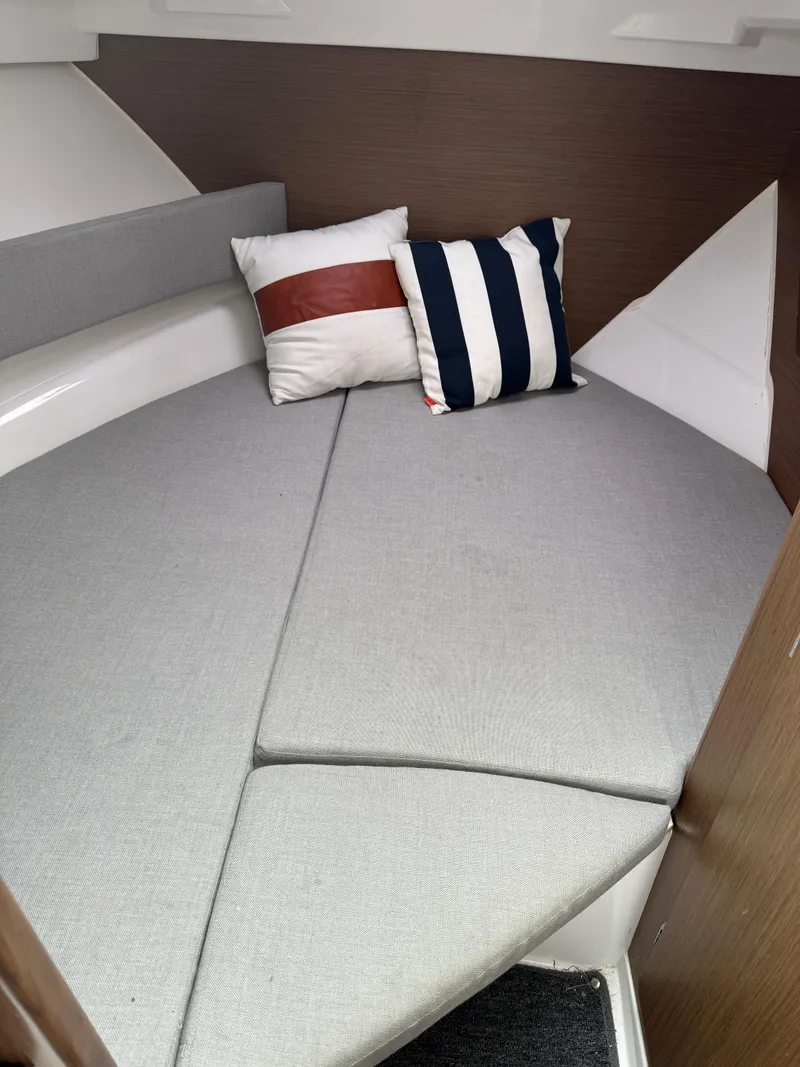 Slide: The Image of Interior cabin of 2020 Jeanneau NC Sport 795 with cushions and pillows. - 20