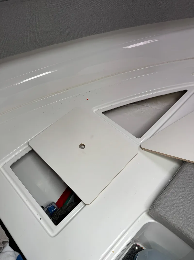 Slide: The Image of 2020 Jeanneau NC Sport 795 boat interior with open storage compartments. - 48