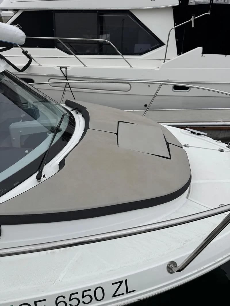 Slide: The Image of 2020 Jeanneau NC Sport 795 boat docked, featuring sleek design and modern detailing. - 5